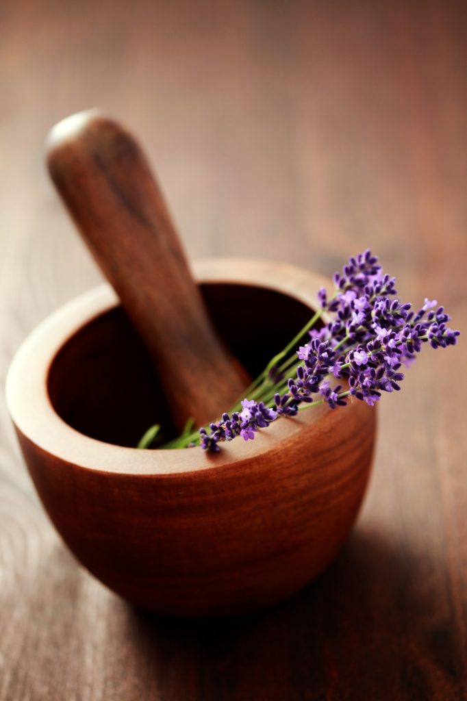 dried lavender in a mortar and pestle