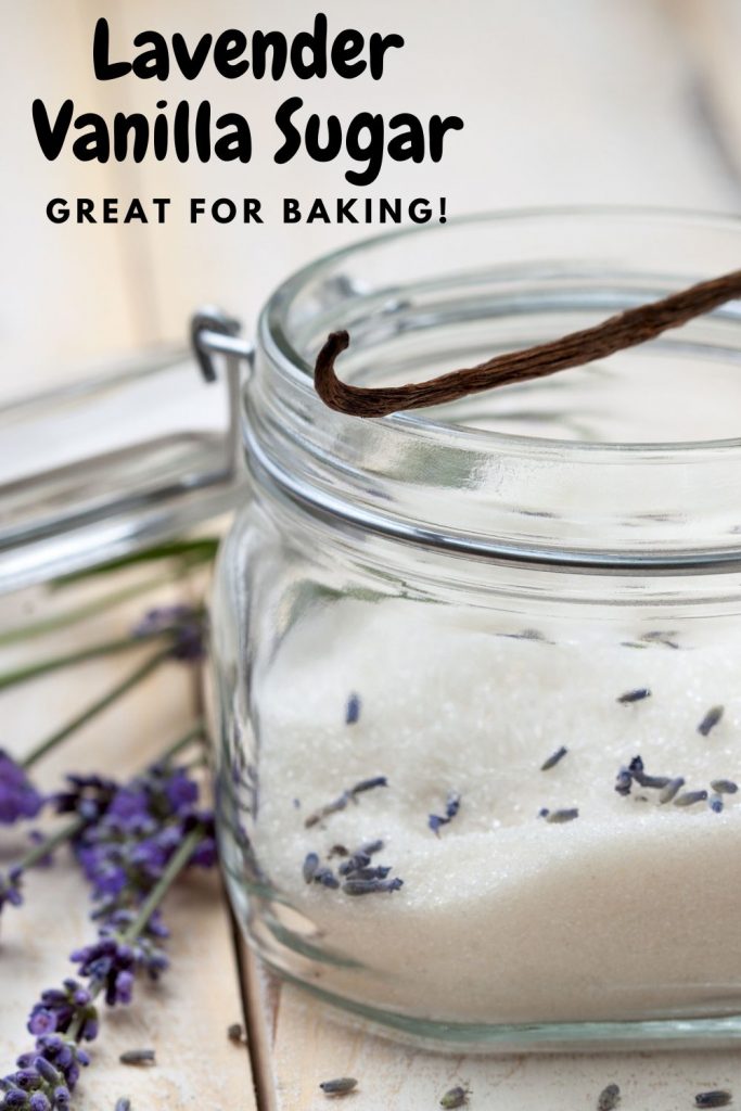 closeup of lavender sugar in a glass jar topped with a whole vanilla bean
