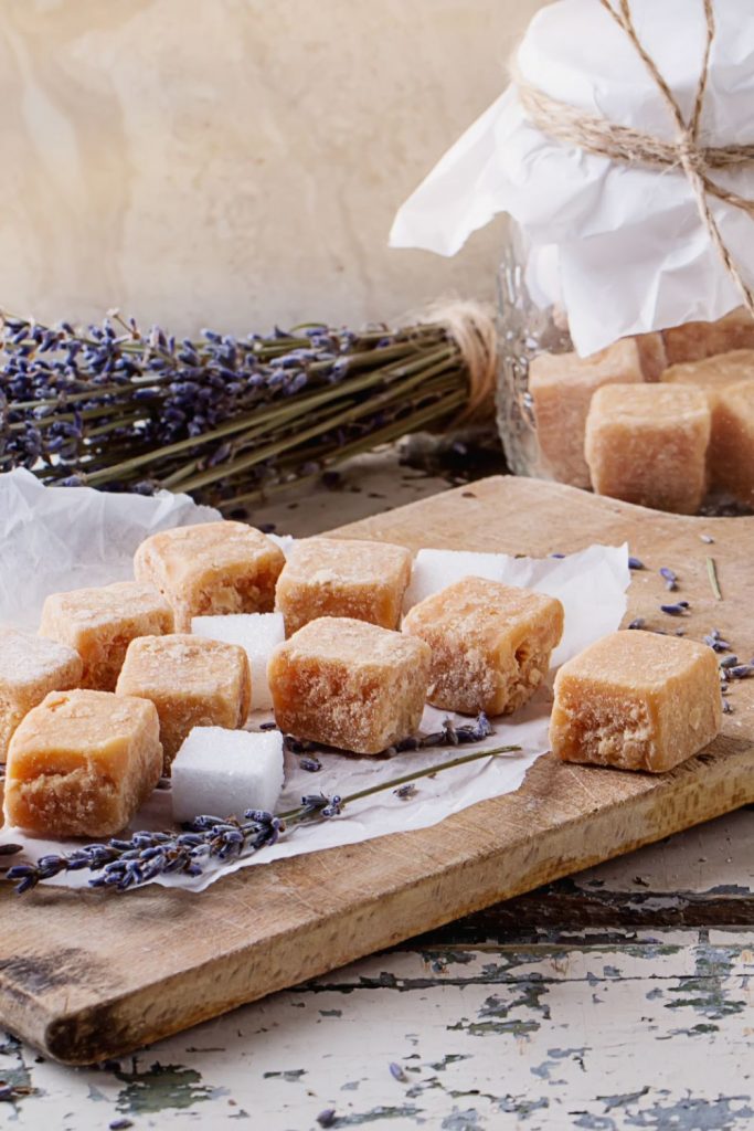 lavender infused sugar cubes on a cutting board